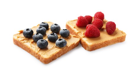 Photo of Tasty peanut butter sandwiches with fresh berries on white background