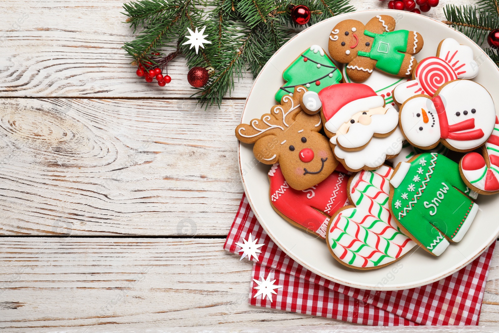 Photo of Delicious Christmas cookies on white wooden table, flat lay. Space for text