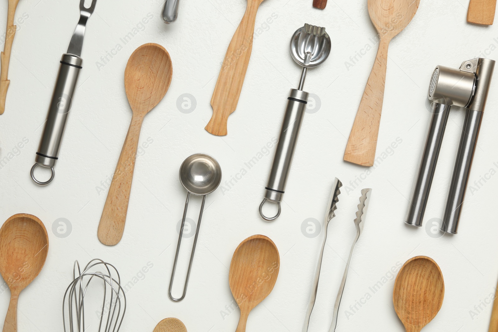 Photo of Set of cooking utensils on white background, flat lay