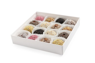 Photo of Different delicious vegan candy balls in box on white background