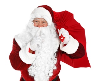Authentic Santa Claus with bag full of gifts on white background