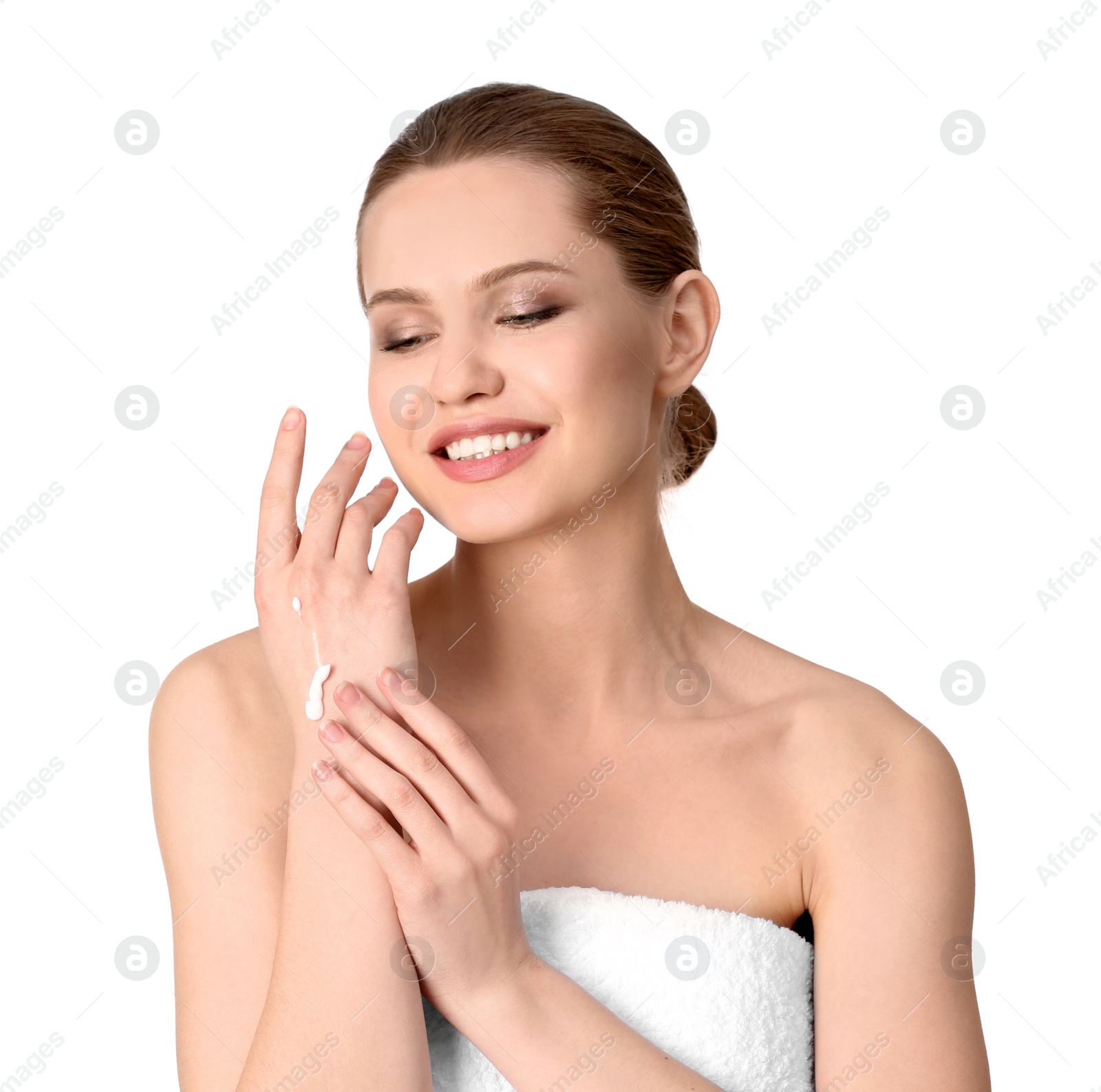 Photo of Young woman applying hand cream on white background