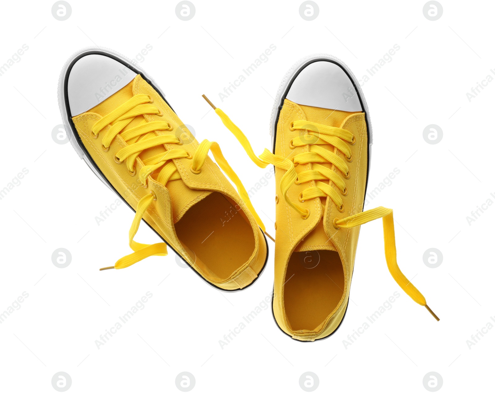 Photo of Pair of trendy sneakers isolated on white, top view