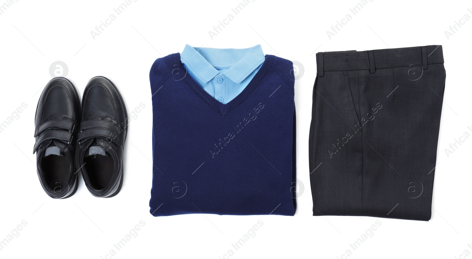 Photo of New stylish school uniform on white background, top view