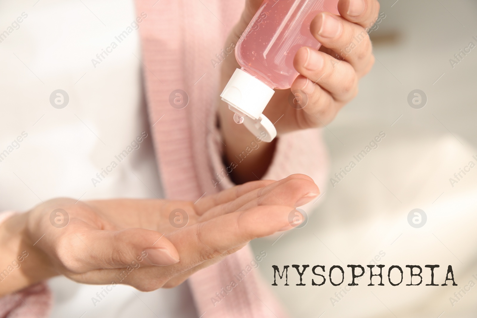 Image of Woman applying antiseptic gel indoors, closeup. Mysophobia
