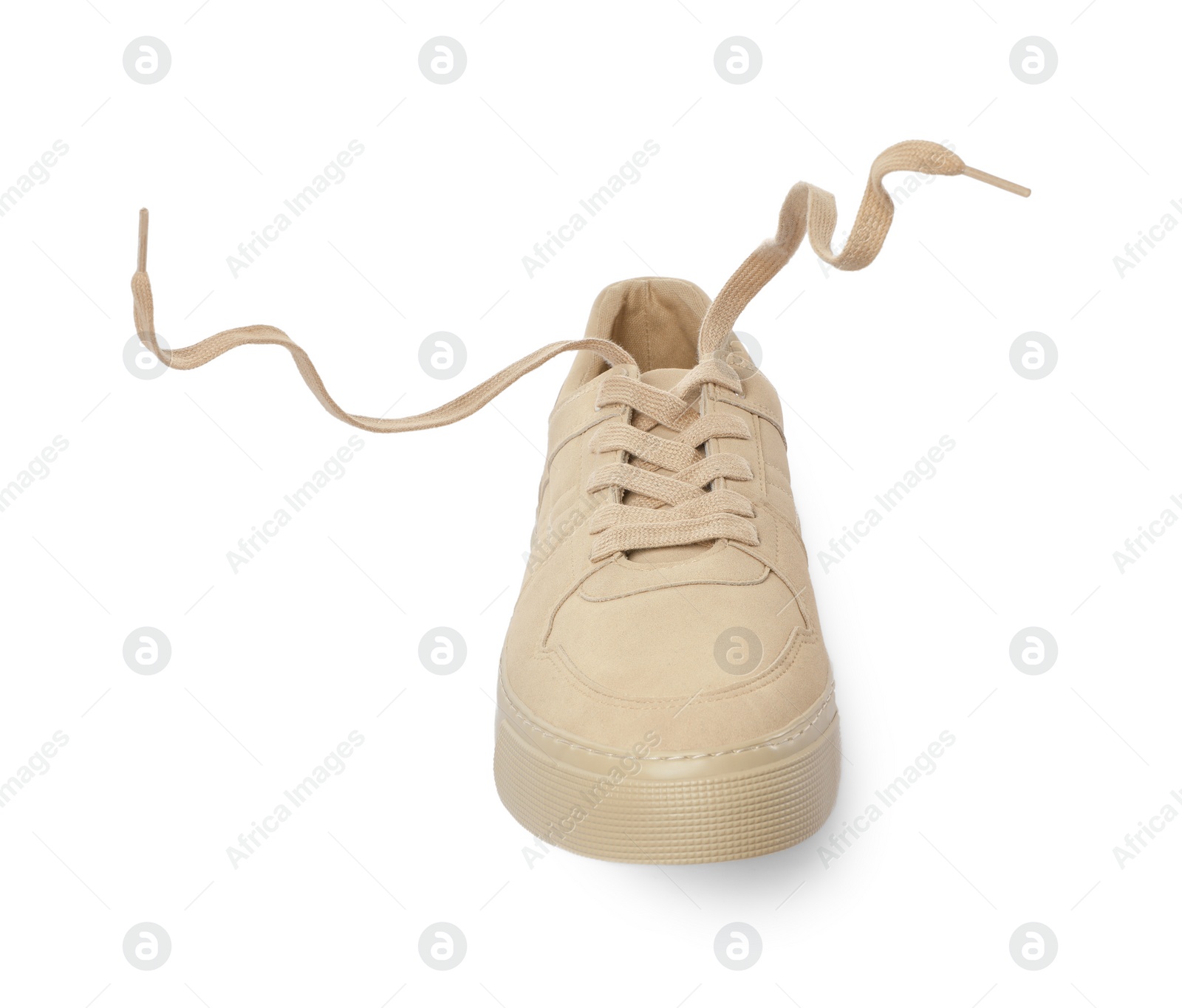 Photo of One stylish beige sneaker isolated on white