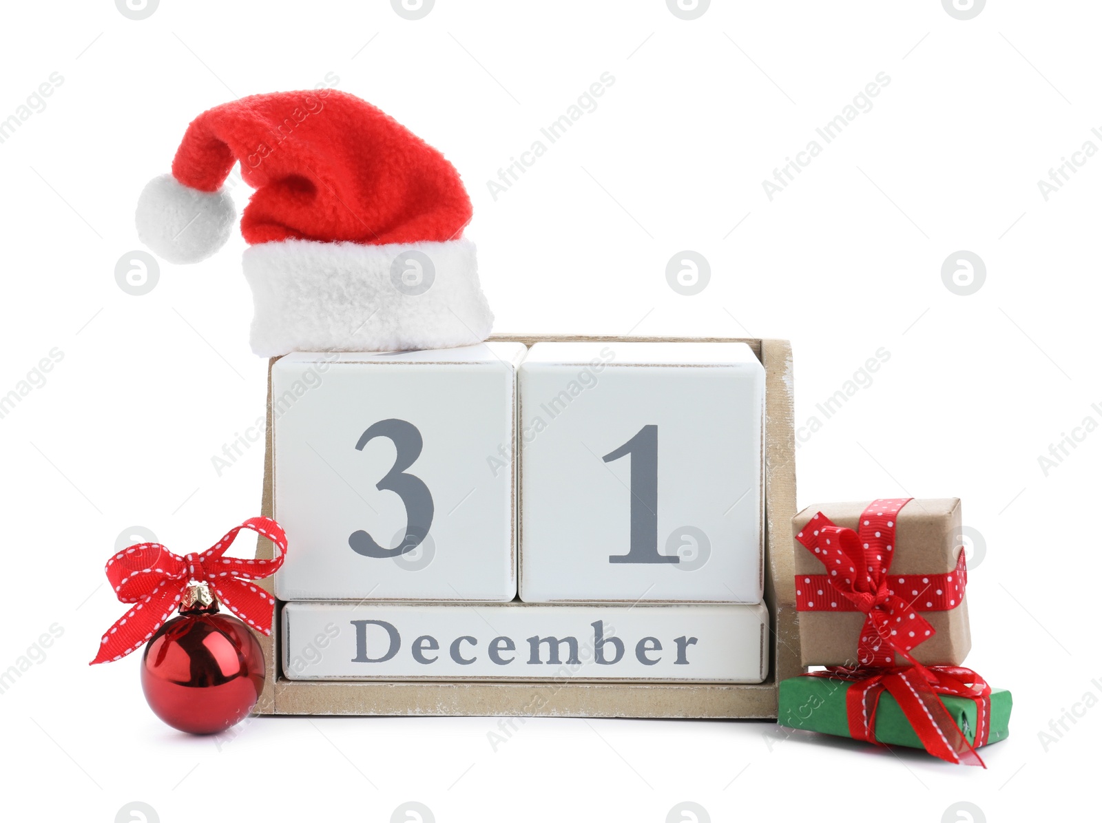 Photo of Wooden block calendar, Christmas ball, Santa hat and gifts on white background. New Year countdown