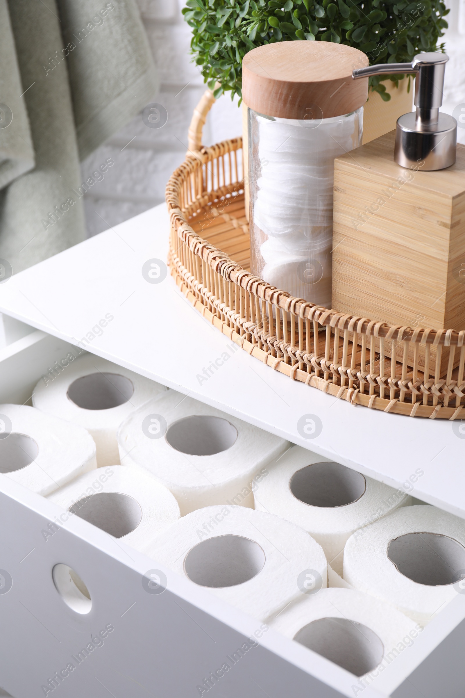 Photo of Many toilet paper rolls in white drawer indoors