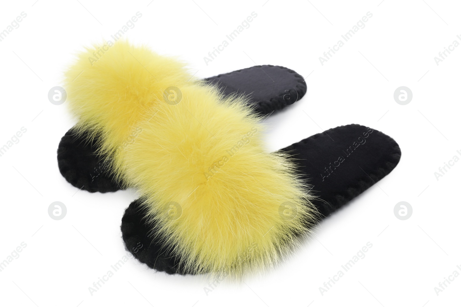 Photo of Pair of fluffy slippers isolated on white