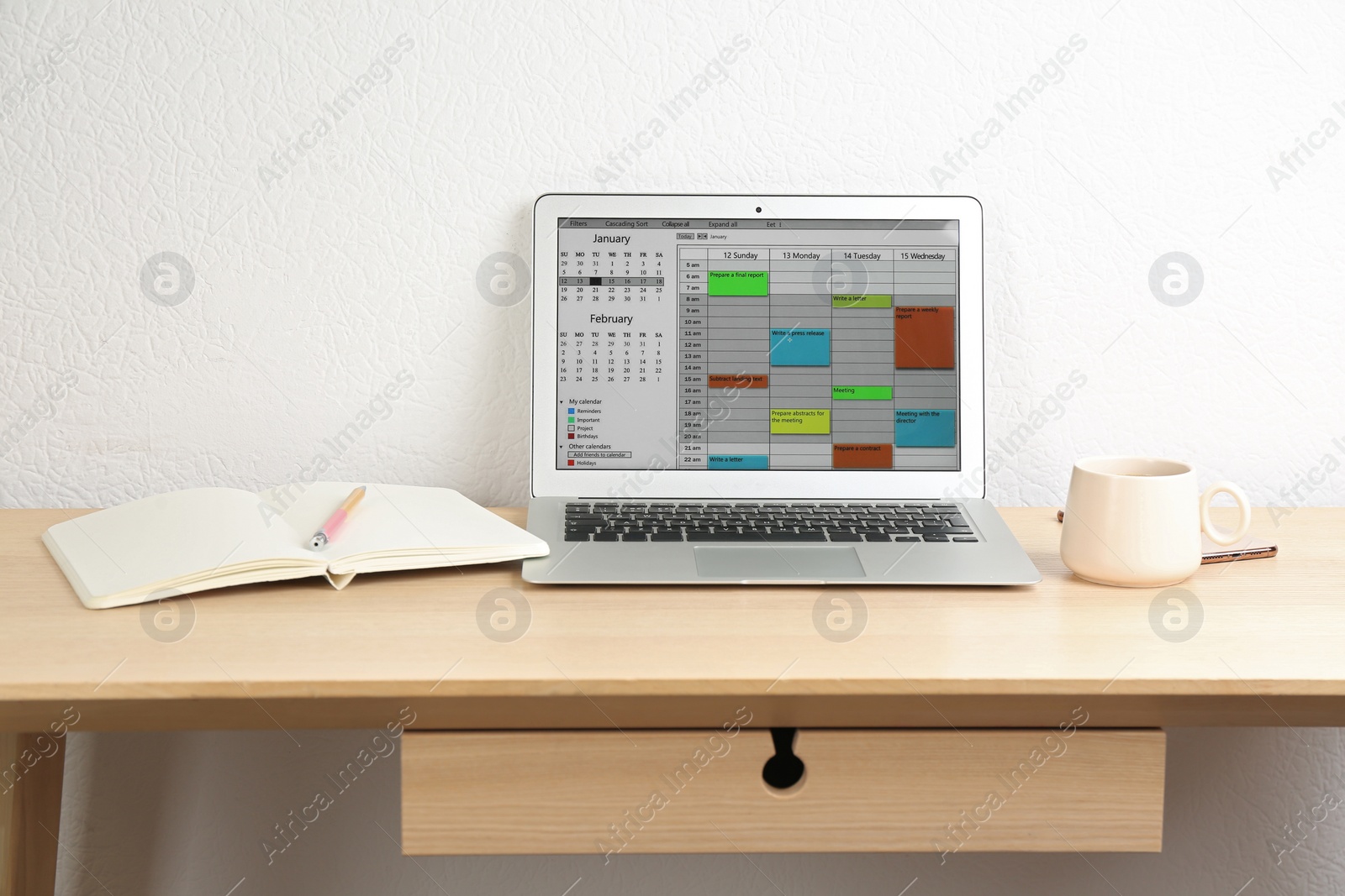 Photo of Modern laptop with calendar app in office