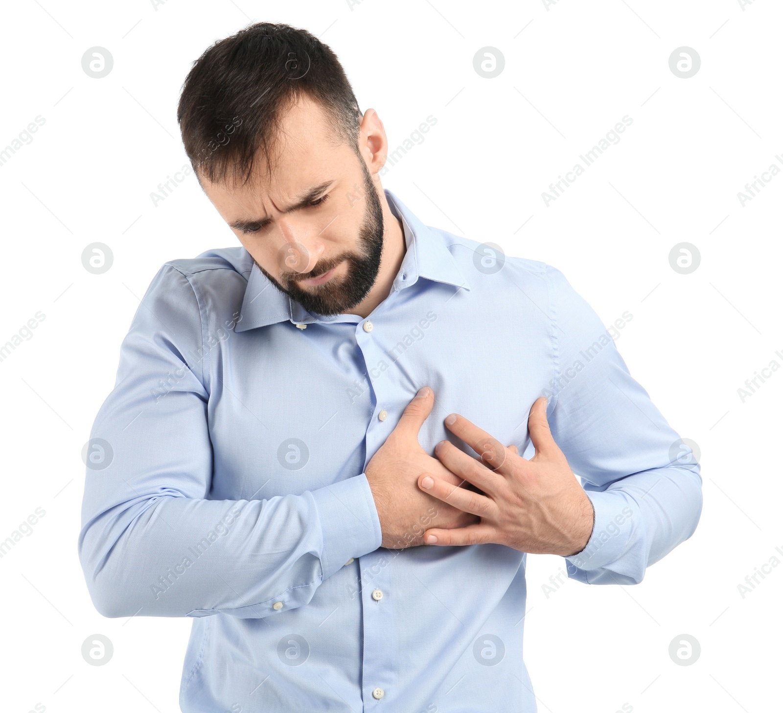 Photo of Young man suffering from chest pain on white background