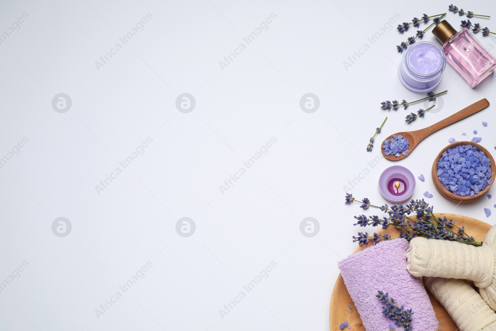 Photo of Composition with lavender flowers and natural cosmetic products on white background, top view