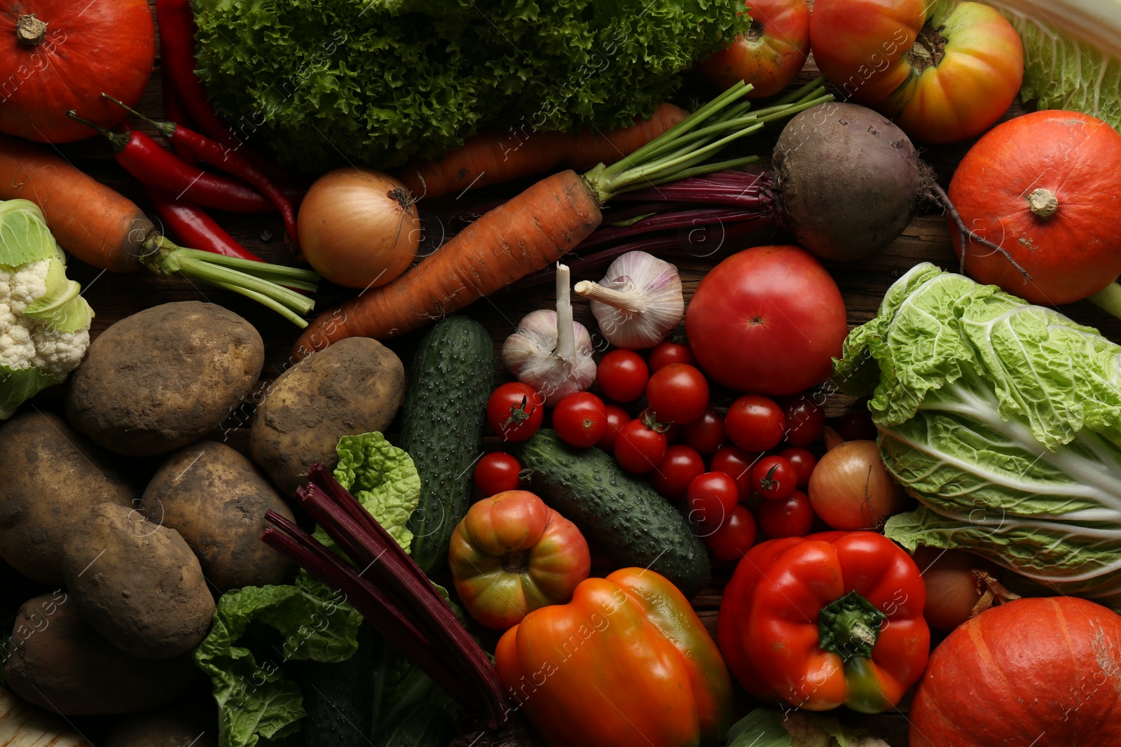 Photo of Different fresh ripe vegetables on table, flat lay. Farmer produce