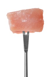 Fondue fork with piece of raw meat isolated on white