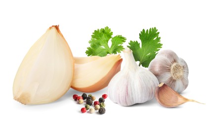 Image of Cut onion, mixed peppercorns, coriander, garlic bulbs and clove on white background