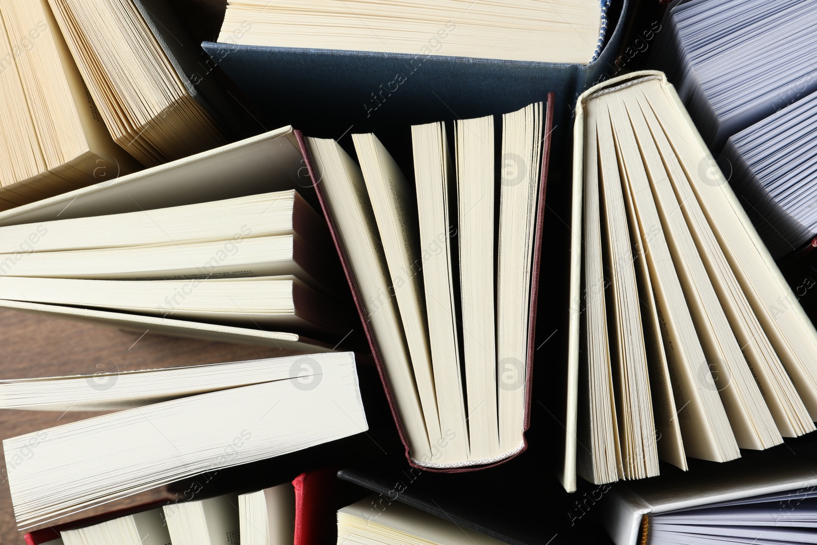 Photo of Many hardcover books as background, top view