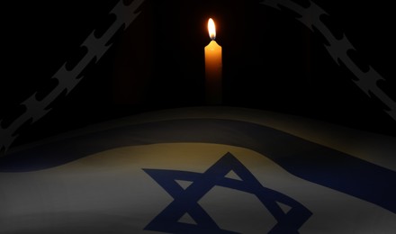 Image of Holocaust Remembrance Day, banner design. Flag of israel, burning candle and barbed wire
