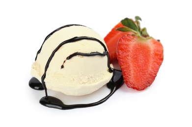 Ball of delicious vanilla ice cream with strawberry and sauce on white background