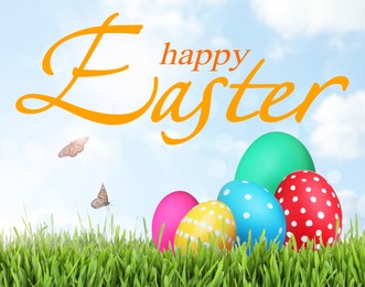 Image of Happy Easter. Bright eggs on green grass outdoors