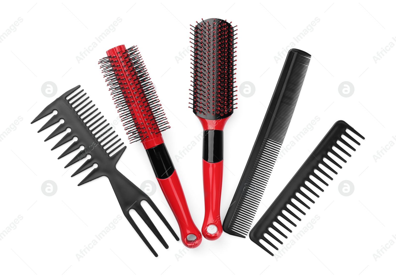 Photo of Set of hair brushes and combs isolated on white, top view