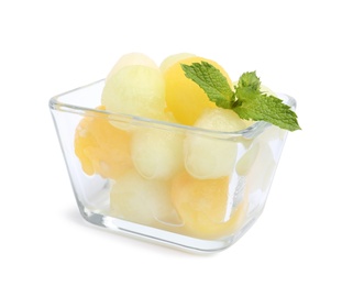 Photo of Glass bowl of melon balls with mint on white background