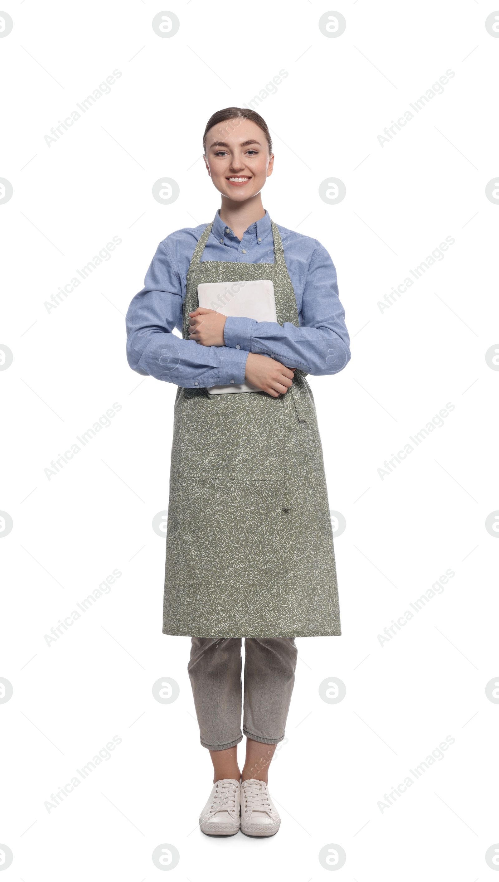 Photo of Beautiful young woman in clean apron with tablet on white background