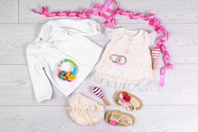 Flat lay composition with stylish child clothes on light background