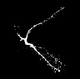 Photo of Splash of fresh milk on black background