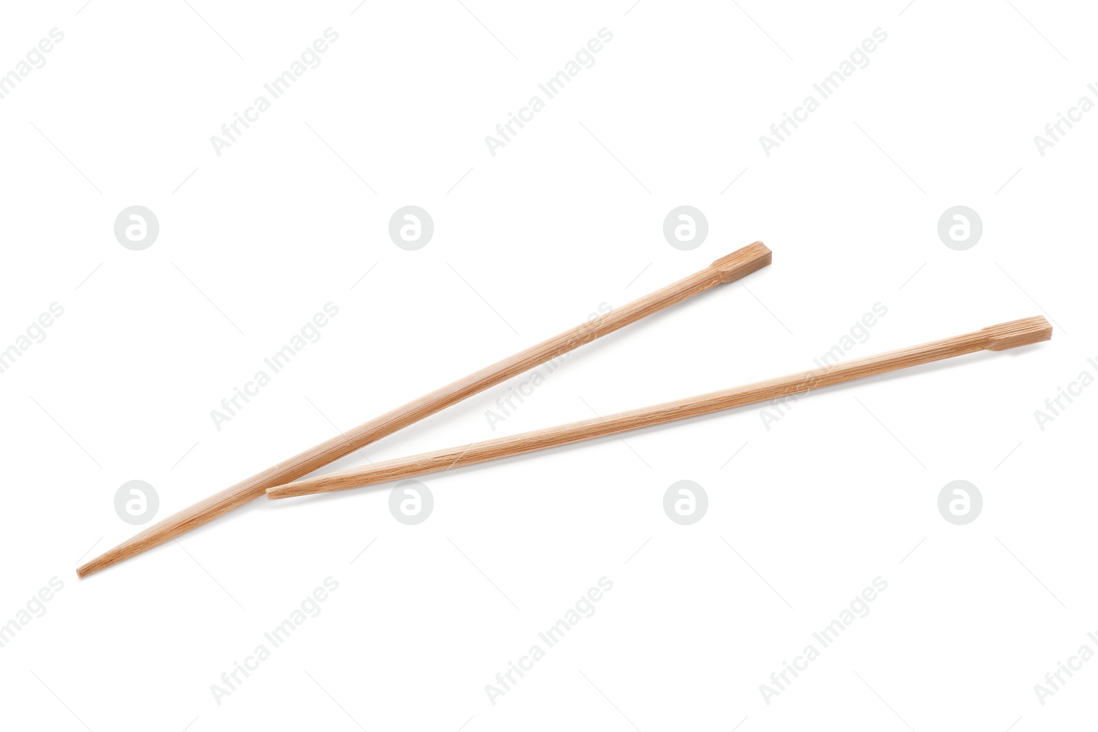 Photo of Chopsticks made of bamboo on white background