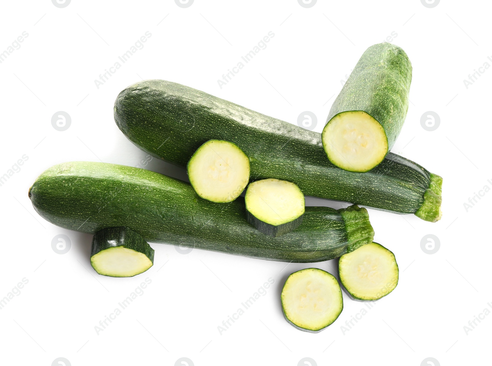 Photo of Fresh ripe green zucchinis isolated on white, top view