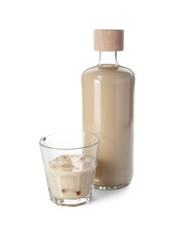 Photo of Bottle and glass of coffee cream liqueur isolated on white