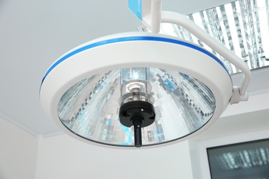 Photo of Powerful surgical lamp in modern operating room