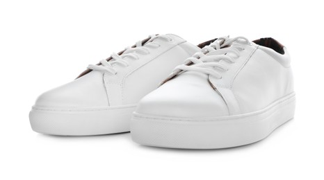 Pair of stylish sneakers on white background