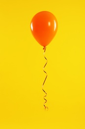 Bright balloon on color background. Celebration time