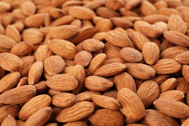 Photo of Organic almond nuts as background. Healthy snack