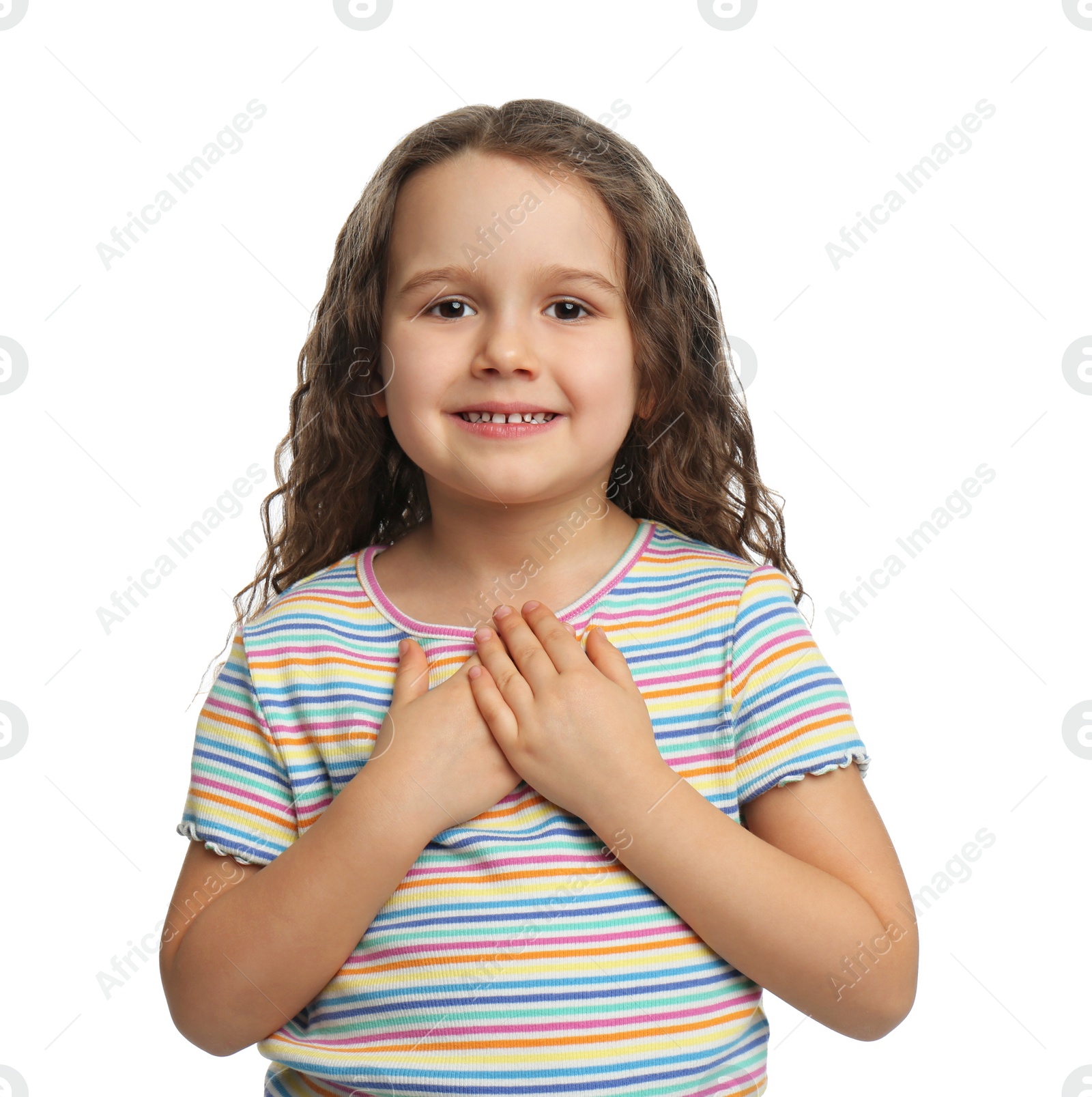 Photo of Cute grateful little girl with hands on chest, white background