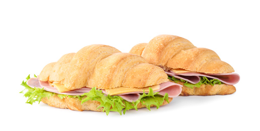 Photo of Tasty croissant sandwiches with ham isolated on white