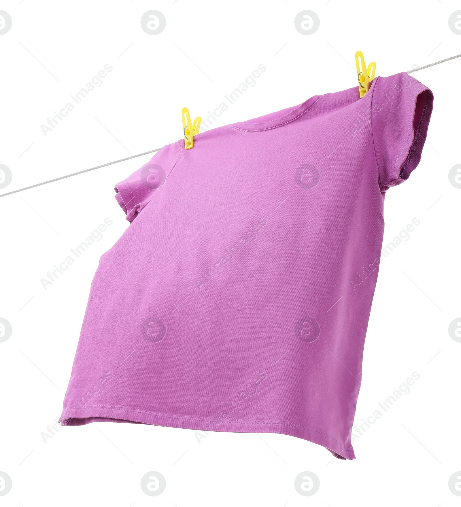 Photo of One violet t-shirt drying on washing line isolated on white