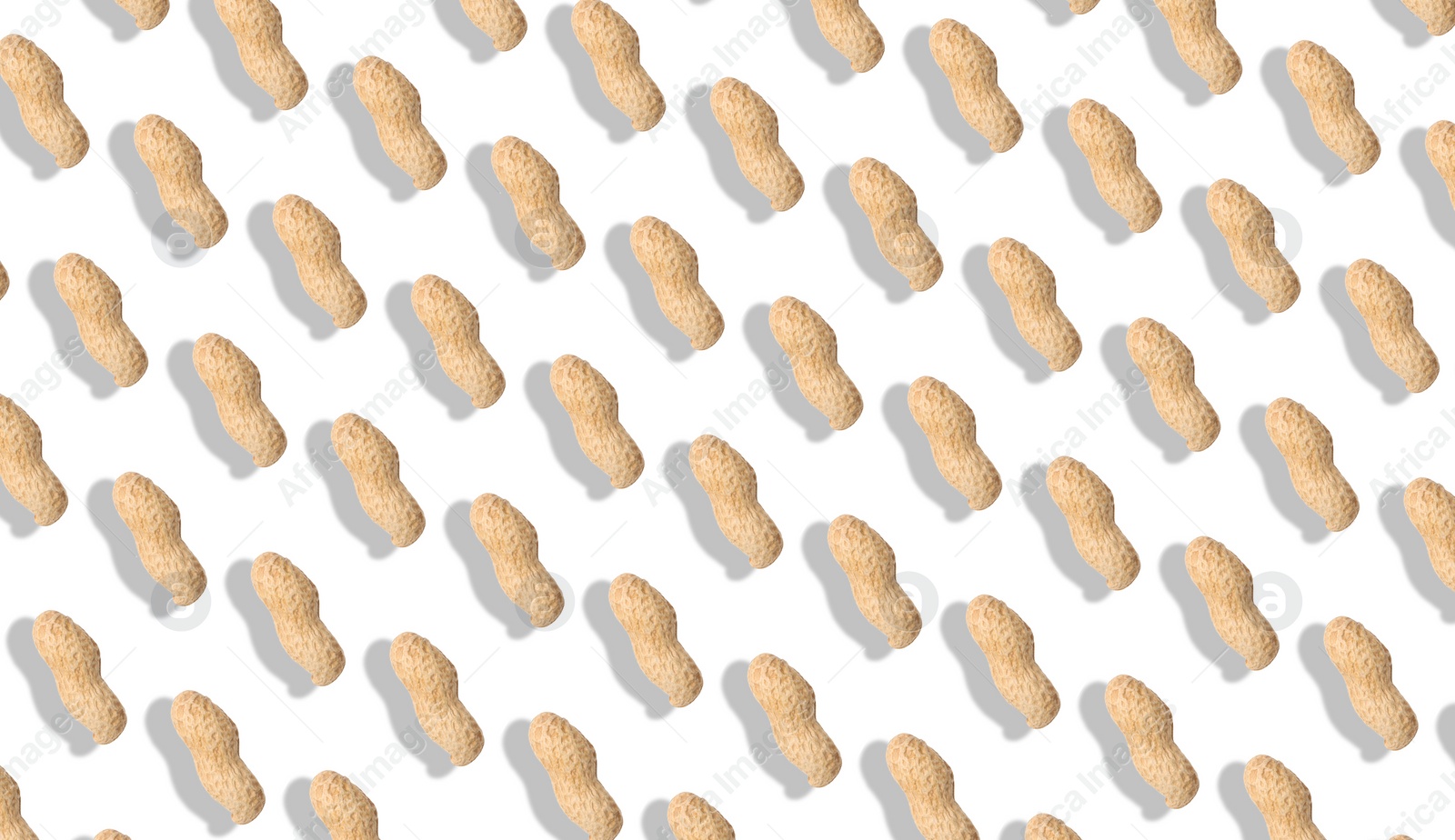 Image of Unpeeled peanuts on white background. Pattern, banner design