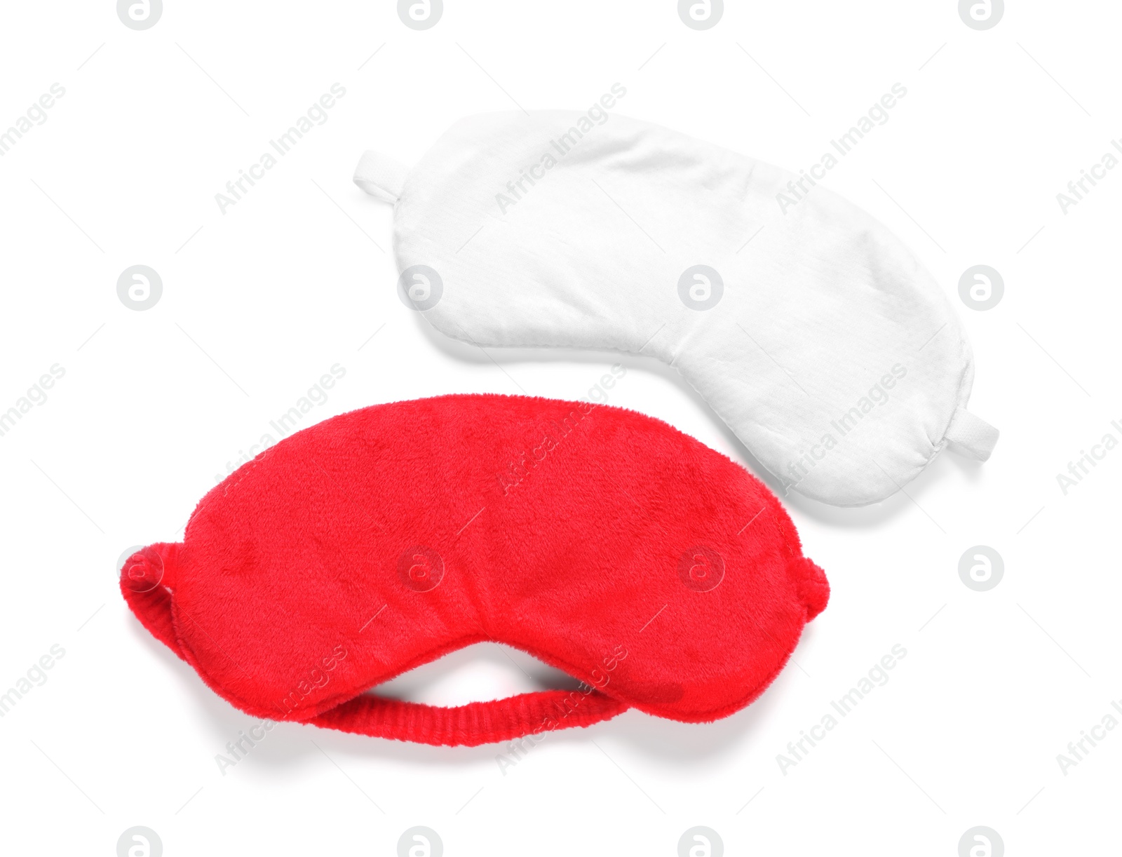 Photo of Two soft sleep masks isolated on white, top view