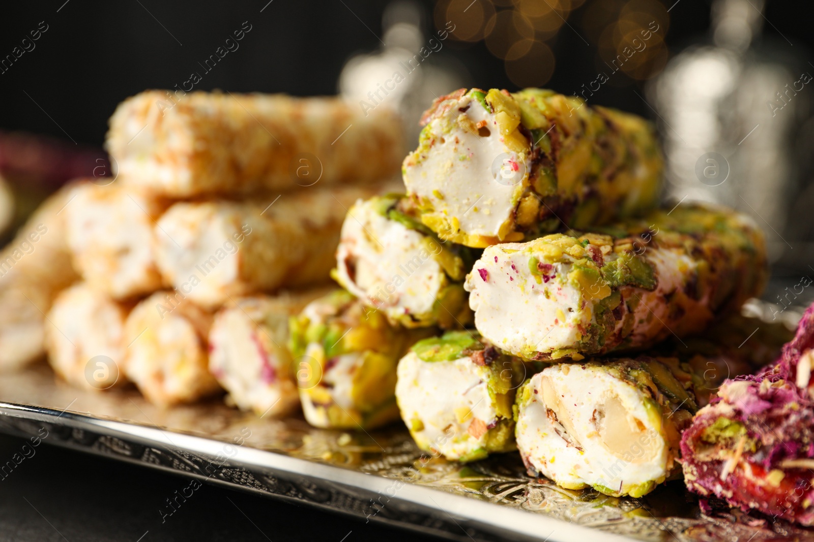 Photo of Turkish delight dessert on tray, closeup. Traditional sweet