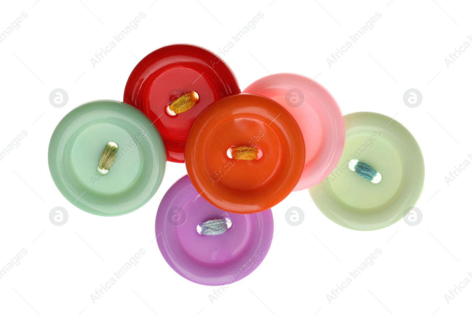 Photo of Many colorful sewing buttons on white background, top view