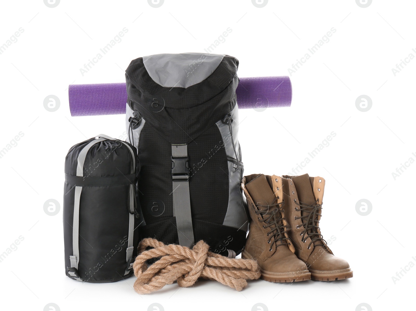 Photo of Set of camping equipment with sleeping bag on white background