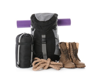 Photo of Set of camping equipment with sleeping bag on white background