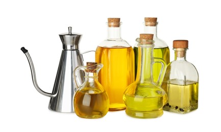 Photo of Vegetable fats. Bottles and jugs of different cooking oils isolated on white