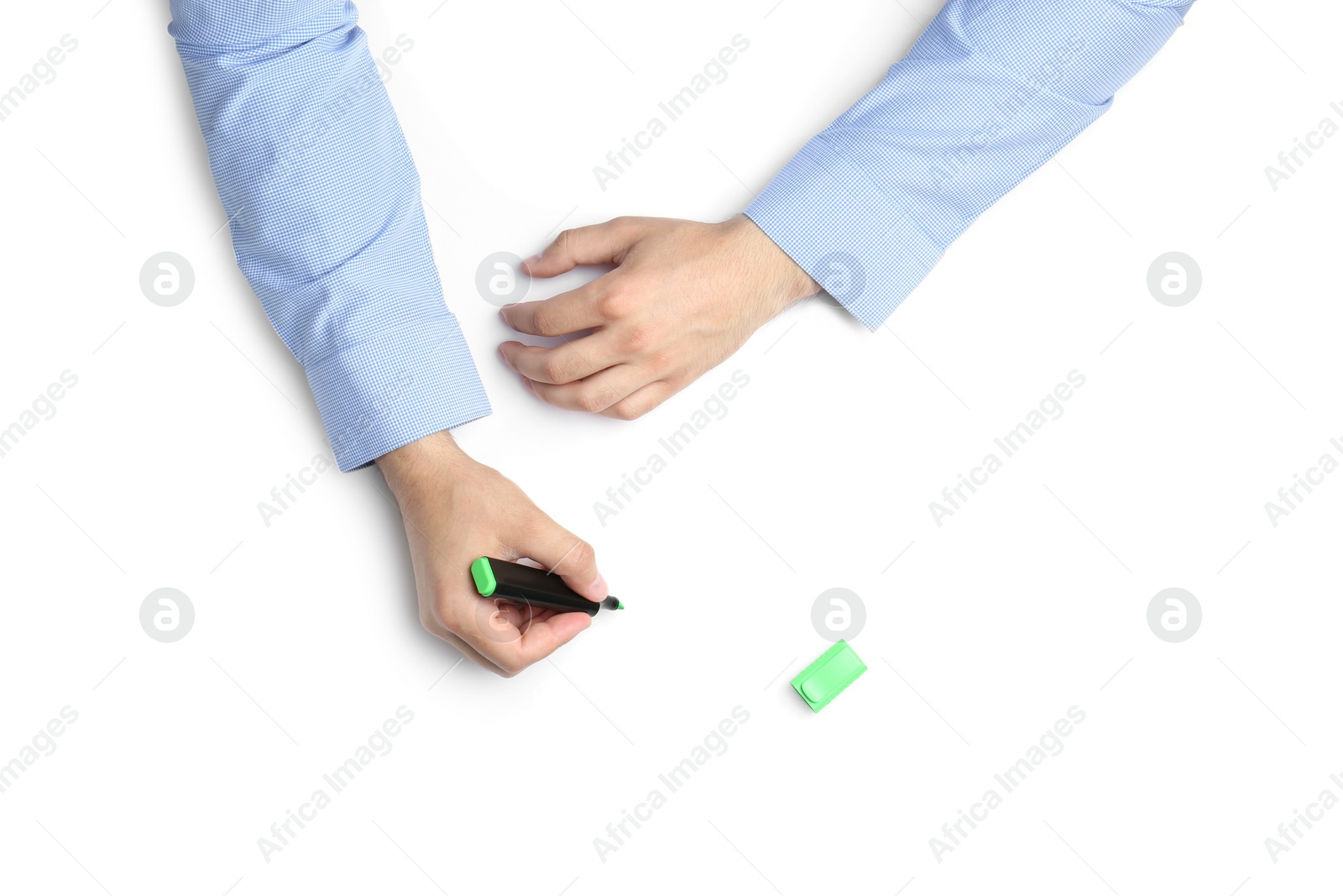 Photo of Man with highlighter on white background, top view. Closeup of hands