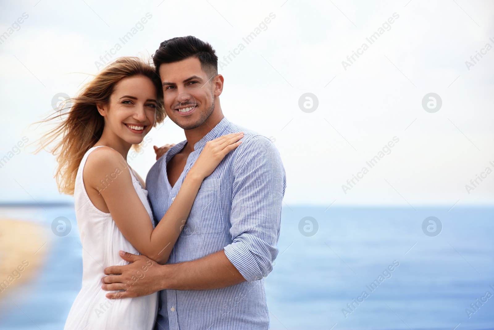 Photo of Happy couple on beach, space for text. Romantic walk