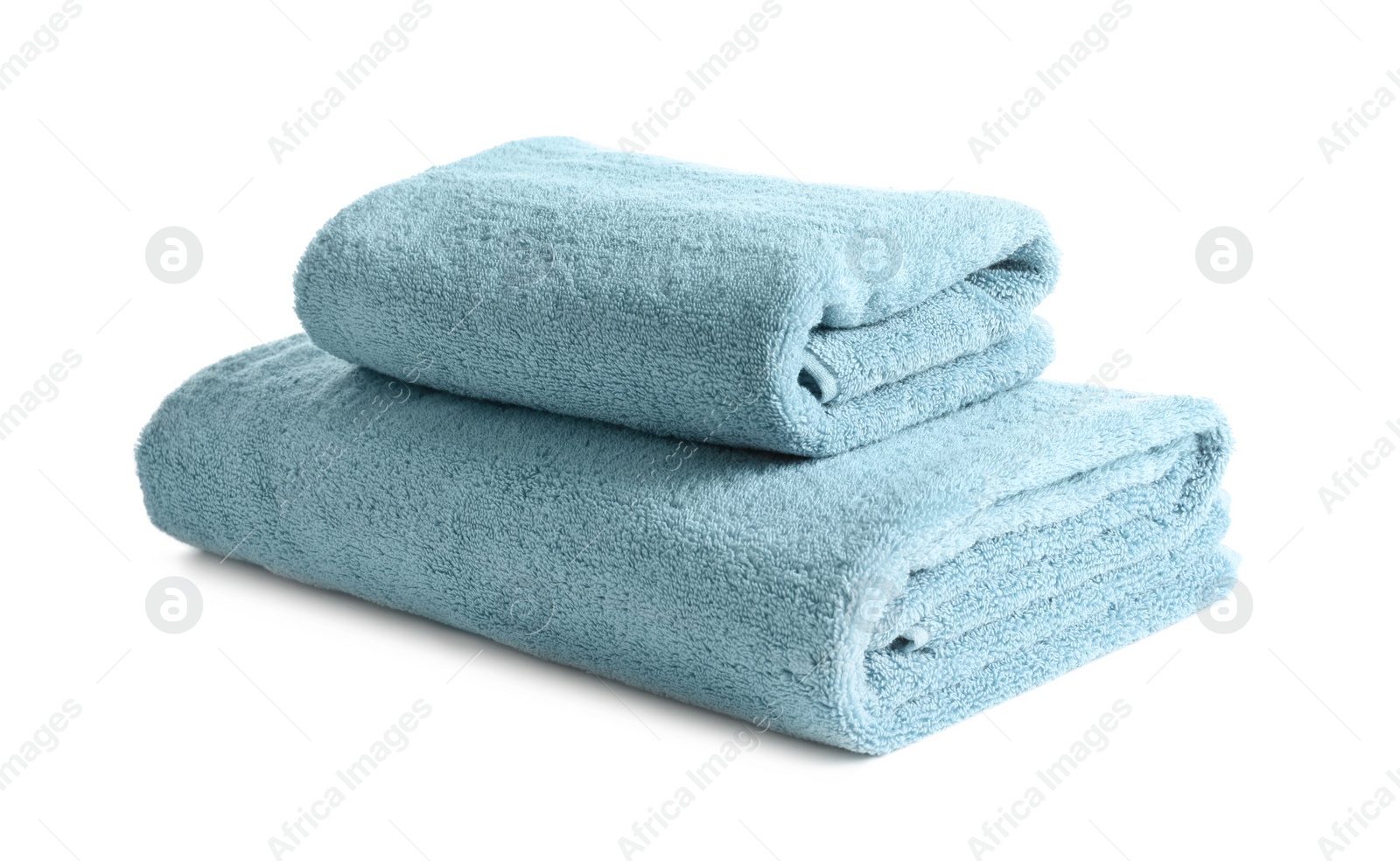 Photo of Folded clean soft towels on white background