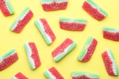 Photo of Tasty jelly candies on color background, flat lay