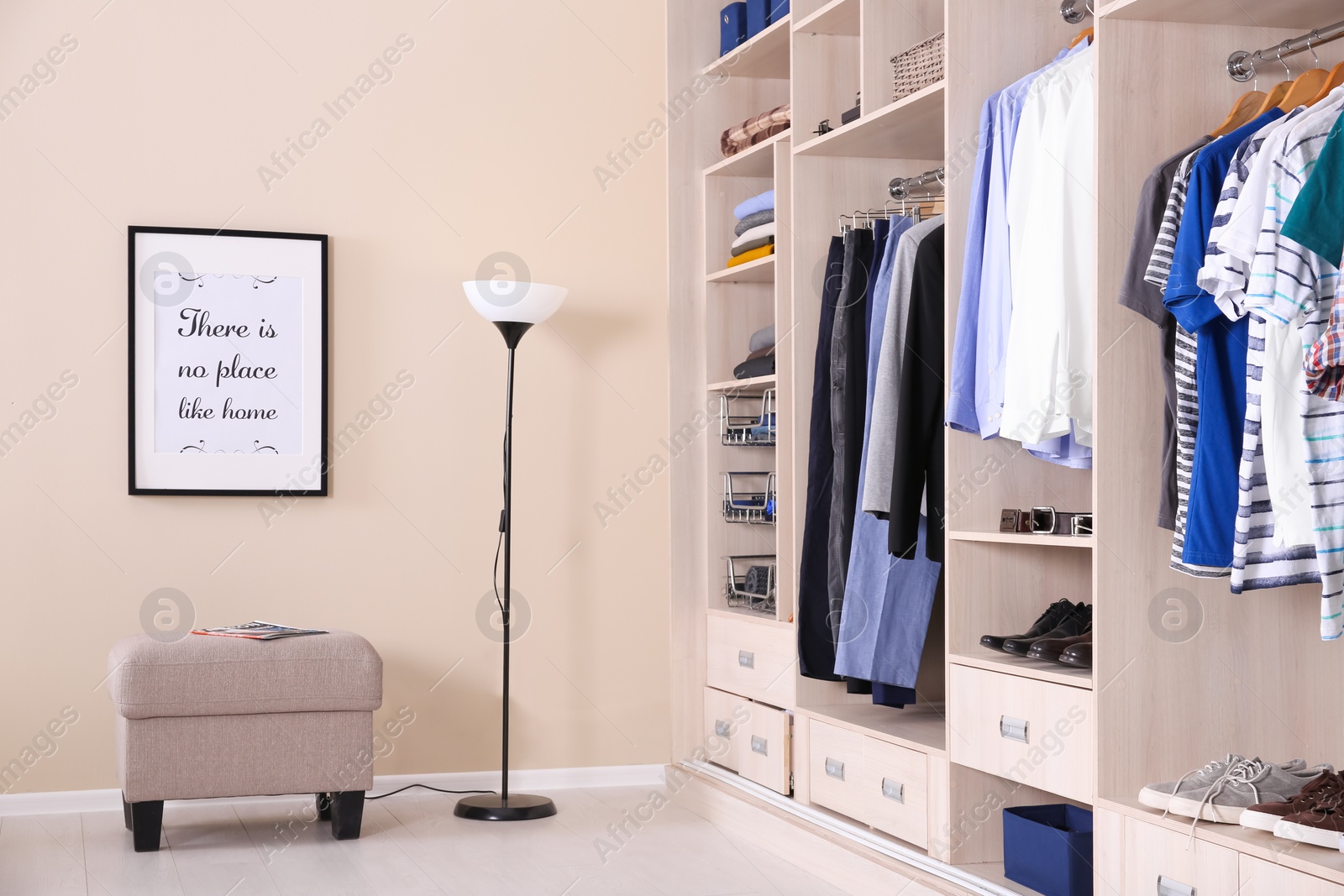 Photo of Room interior with wardrobe and stylish ottoman chair